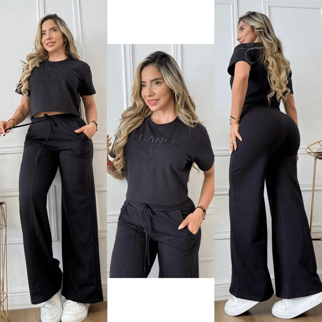 Conjunto bordado negro para mujer con top crop de manga corta y pantalón ancho de tiro alto con cordón y bolsillos, tela suave que estiliza la figura, cómodo y versátil para el día a día