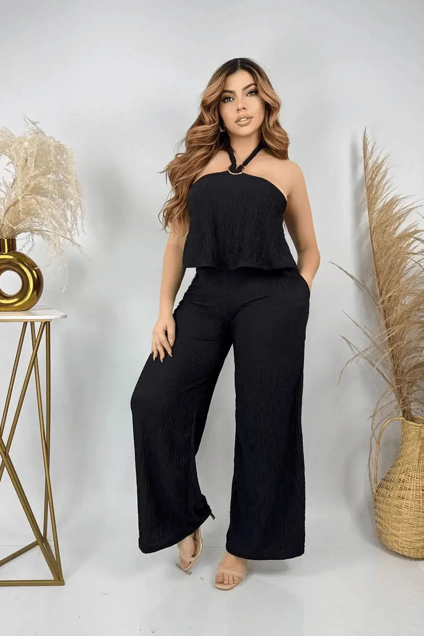 Enterizo Alexa negro para mujer con cuello halter y pantalón ancho en tejido plisado, cómodo, frescura y estilo para día y noche