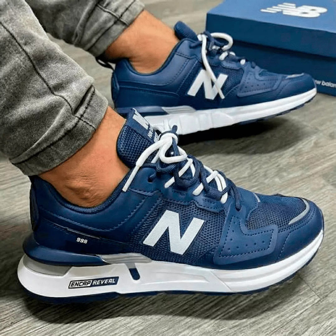 Zapatillas deportivas color azul con detalles blancos, diseño moderno y cómodo, suela resistente con tecnología de amortiguación, ideales para uso diario y actividades físicas, estilo urbano y versátil para hombres.