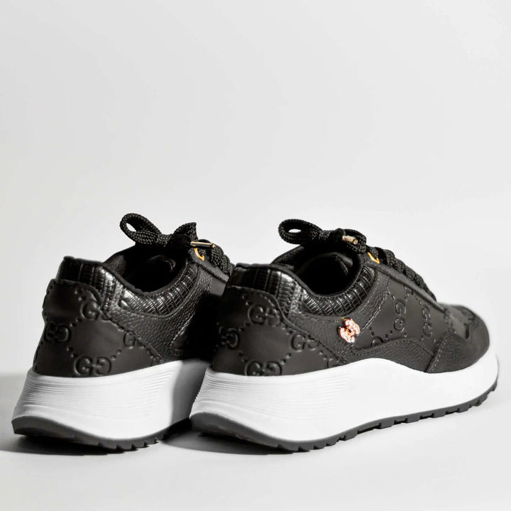 Zapatillas Élite negras para mujer con diseño moderno y elegante, suela blanca antideslizante que brinda comodidad y soporte para uso diario, material resistente y transpirable, ideales para caminar y actividades casuales, calzado deportivo que combina estilo y funcionalidad para un rendimiento óptimo.