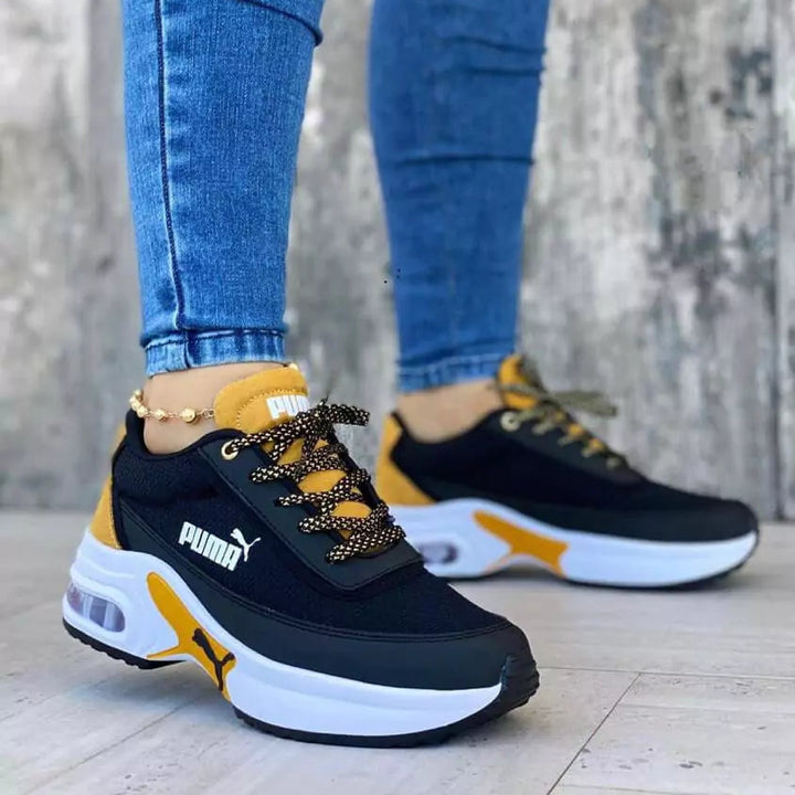 Tenis Sport Run en combinación negro y mostaza para mujer y hombre, diseño audaz con contraste moderno para un look vibrante